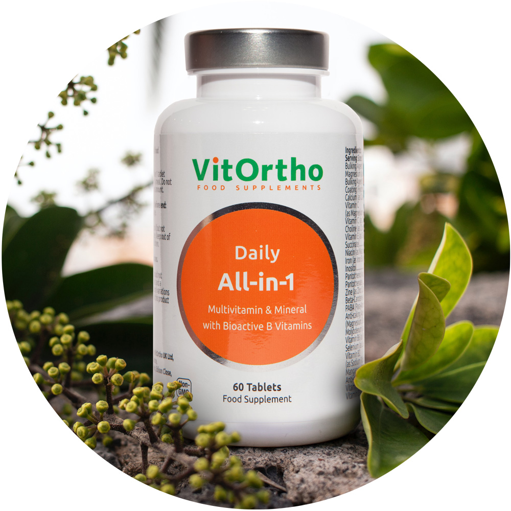 Vitortho Supplements bottle sat in plant